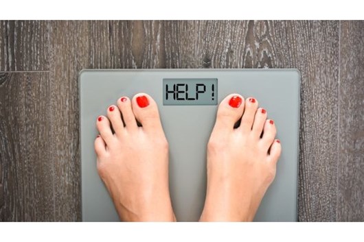 Lose weight concept with person on a scale measuring kilograms